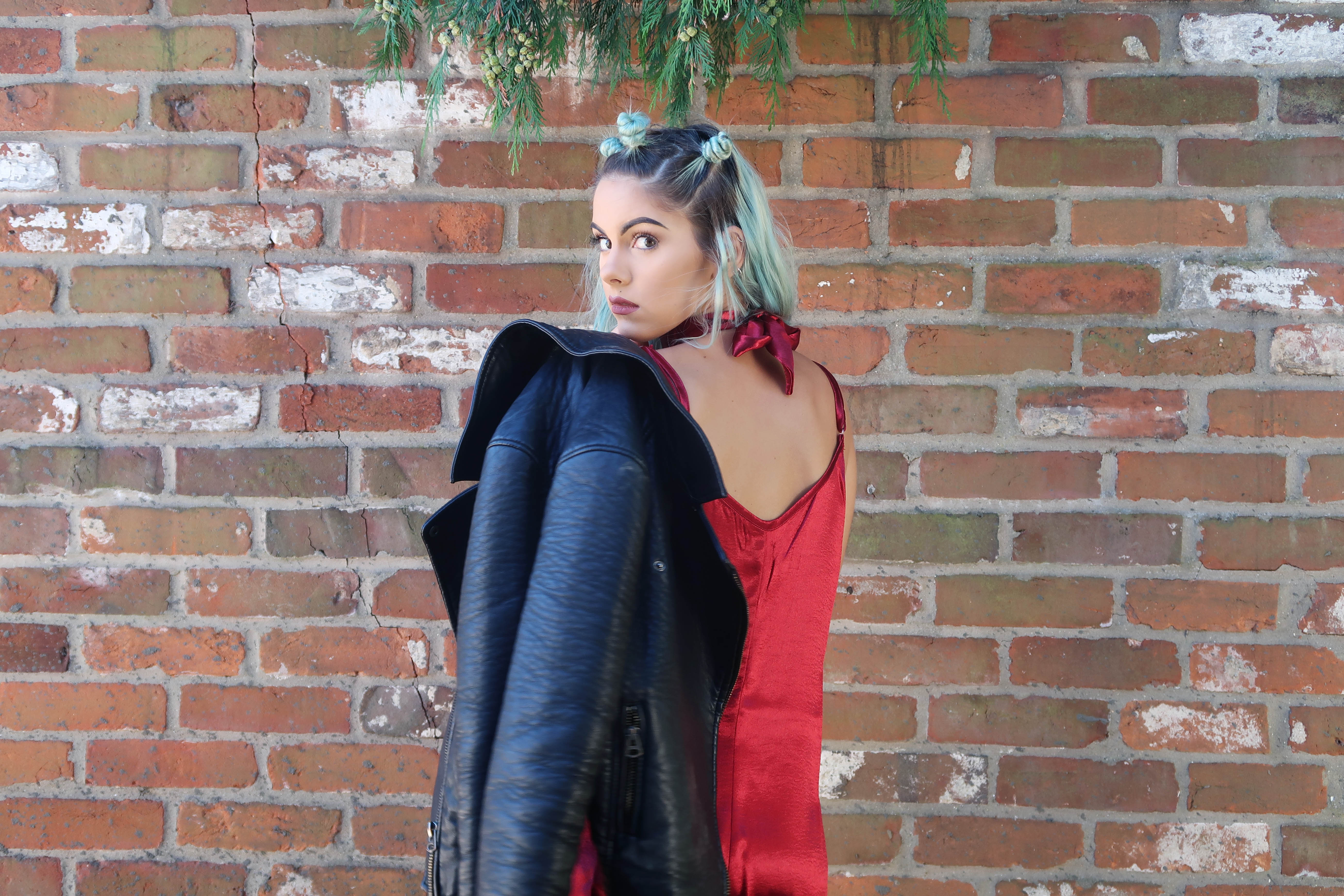 sophie hannah richardson wearing a silk red dress from boohoo