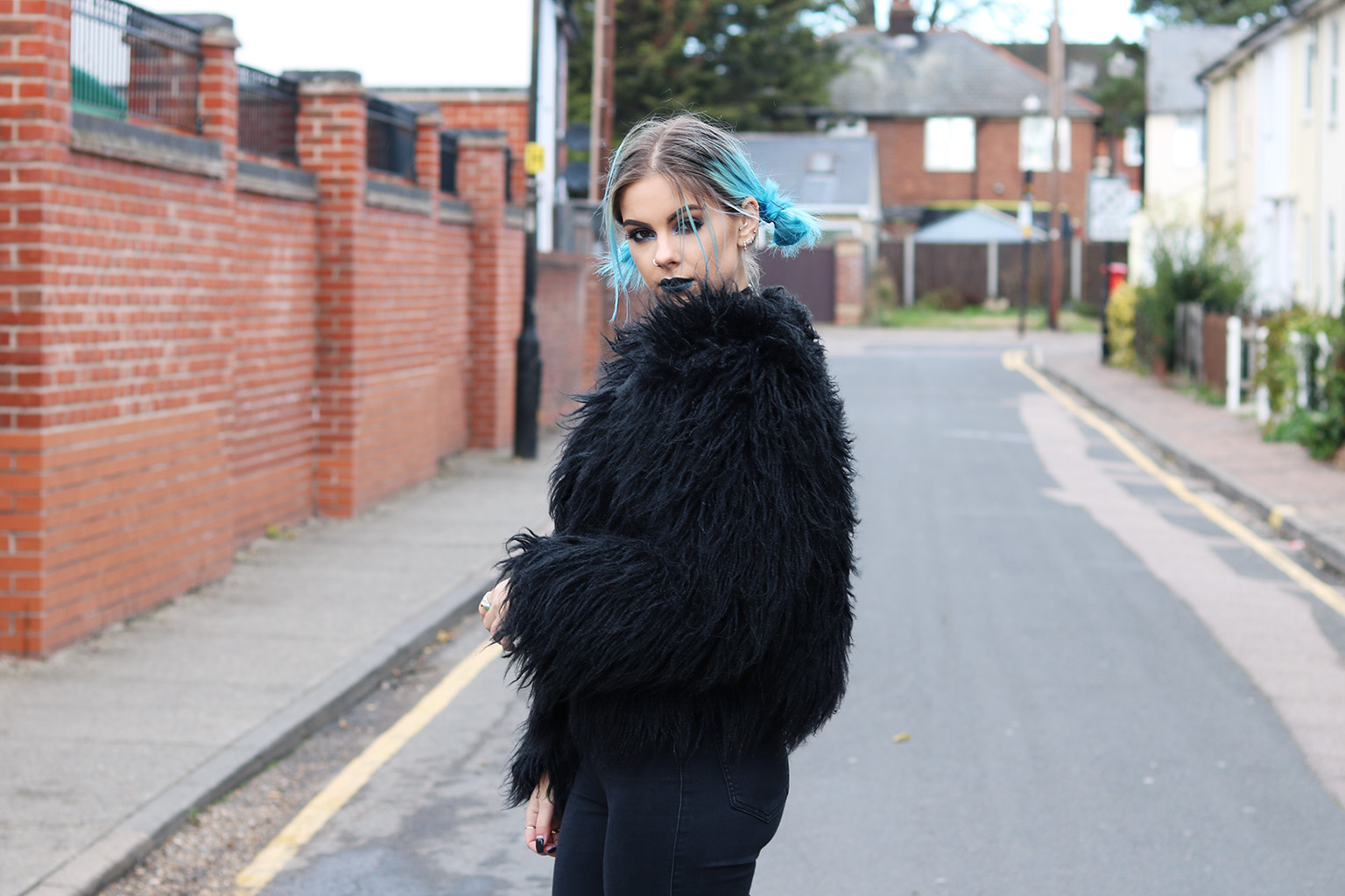 sophie hannah richardson wearing a black faux fur coat