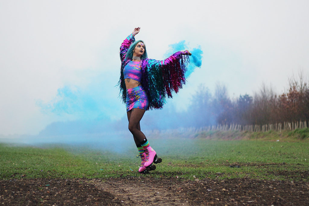 sophie hannah richardson with a smoke grenade celebrating new year goals