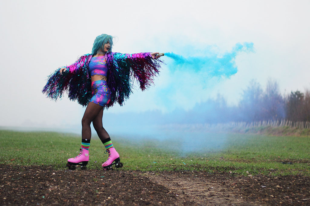 sophie hannah richardson with a smoke grenade celebrating new year goals