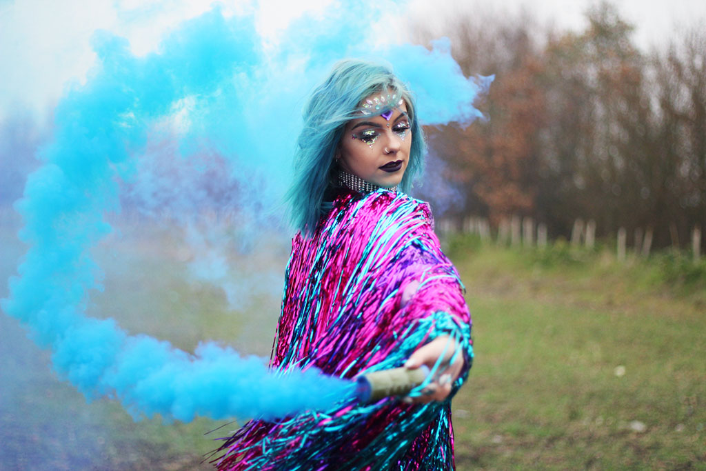sophie hannah richardson with a smoke grenade celebrating new year goals