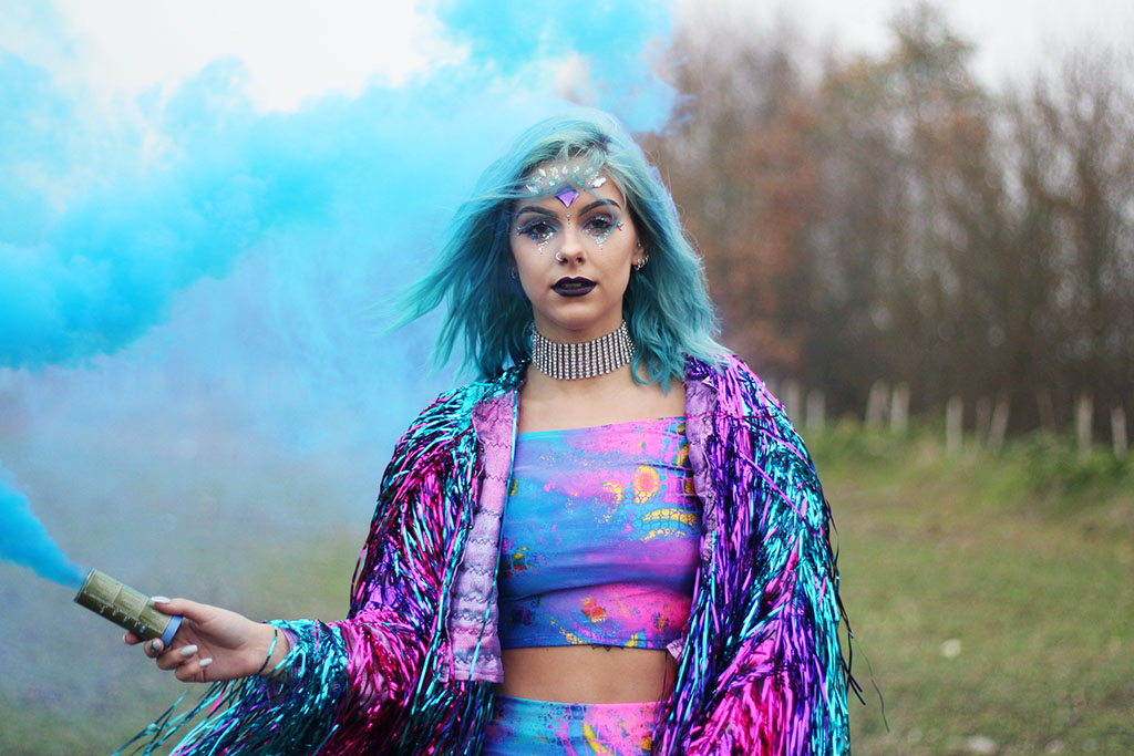 sophie hannah richardson with a smoke grenade celebrating new year goals