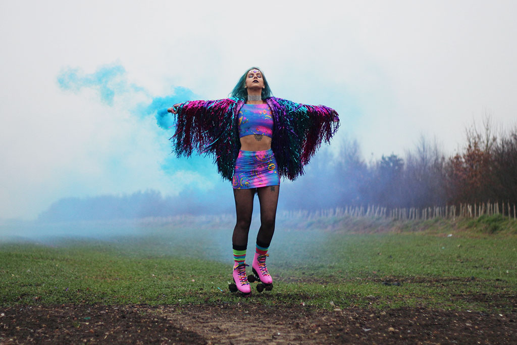 sophie hannah richardson with a smoke grenade celebrating new year goals